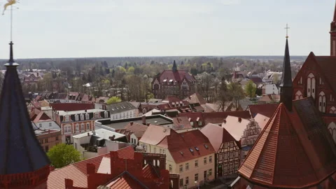 Aerial view with a flight between the town hall and the church of Perleberg. The Stock Footage 163105173