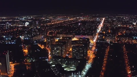 Aerial view, flight on drone above night city Voronezh with illuminated roads Stock Footage 106098569