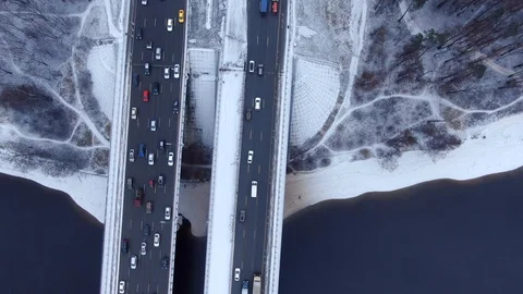 Aerial view flight of drone over clouds with tracking of moving cars Video stock 122034511