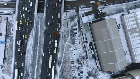 Aerial view flight of drone over clouds with tracking of moving cars Video stock 122035046