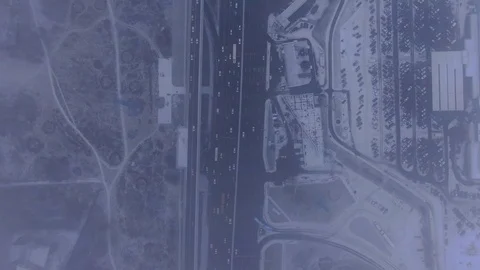 Aerial view flight of drone over clouds with tracking of moving cars Video stock 122037327