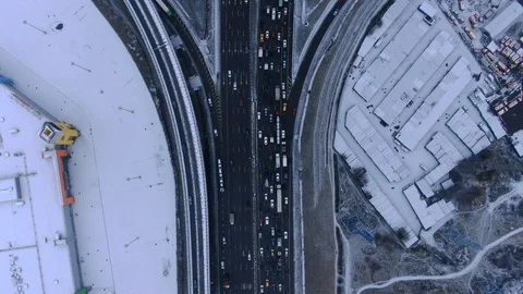 Aerial view flight of drone over clouds with tracking of moving cars Video stock 122038960
