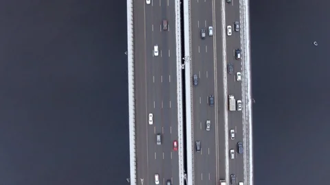 Aerial view flight of drone over clouds with tracking of moving cars Video stock 122041251