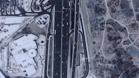 Aerial view flight of drone over clouds with tracking of moving cars Video stock 122077348