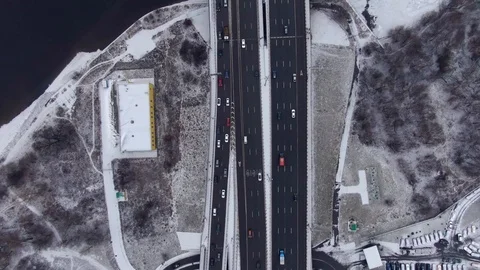 Aerial view flight of drone over clouds with tracking of moving cars Video stock 122077403