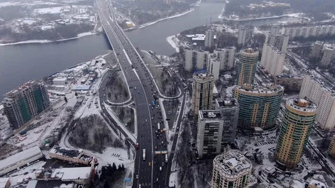 Aerial view flight of drone over clouds with tracking of moving cars Video stock 122077559