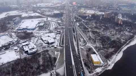 Aerial view flight of drone over clouds with tracking of moving cars Video stock 122077932