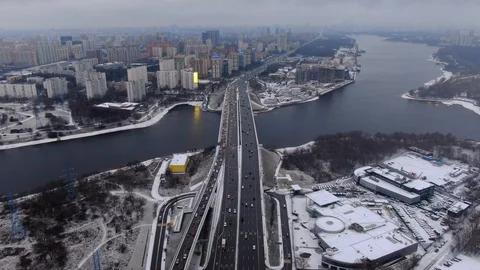 Aerial view flight of drone over clouds with tracking of moving cars Video stock 122078511