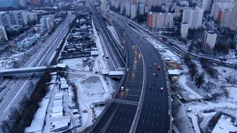 Aerial view flight of drone over clouds with tracking of moving cars Video stock 122079888