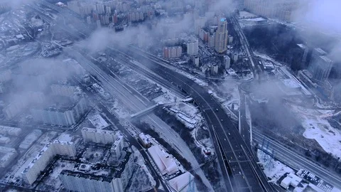 Aerial view flight of drone over clouds with tracking of moving cars Video stock 122079890