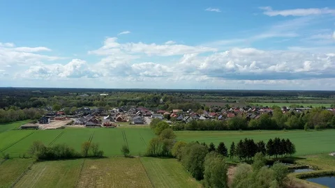 Aerial view of a flight in front of a development area with carcasses Stock Footage 129676877