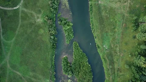 Aerial View: Flight over the Beautiful River and Green Wood. Sunset soft light Stockbeeldmateriaal 159154777