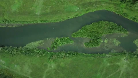 Aerial View: Flight over the Beautiful River and Green Wood. Sunset soft light Stock Footage 159154851