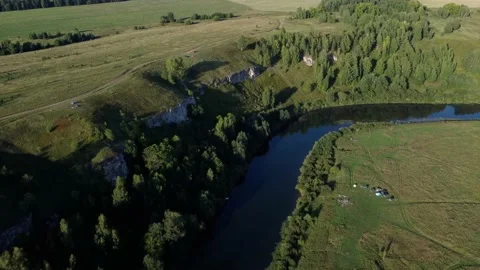 Aerial View: Flight over the Beautiful River and Green Wood. Sunset soft light Stock-Footage 159155195