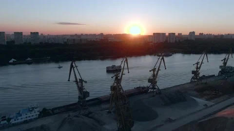 Aerial view flight over cargo port in the big city. Unloading a merchant ship. Stock Footage 137986198