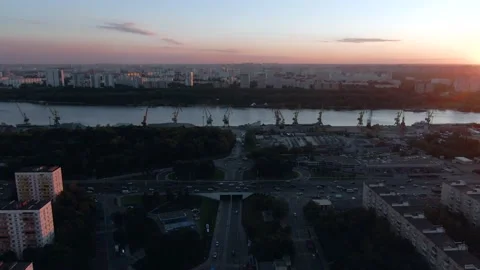 Aerial view flight over cargo port in the big city. Unloading a merchant ship. Video stock 137986312
