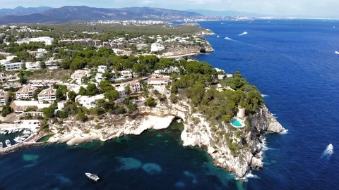 Aerial view, flight over the Five Fingers Bay of Portals Vells, Mallorca, Bal Stock Footage 100641777