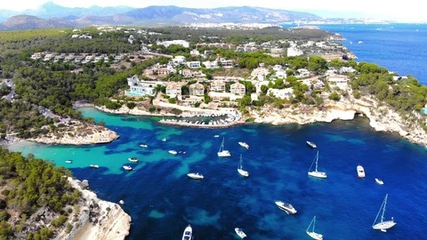 Aerial view, flight over the Five Fingers Bay of Portals Vells, Mallorca, Bal Stock Footage 100641851