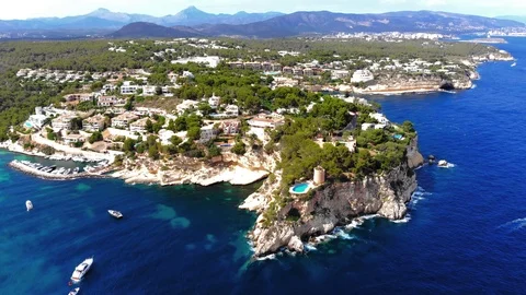 Aerial view, flight over the Five Fingers Bay of Portals Vells, Mallorca, Bal Stock Footage 100642053