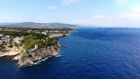 Aerial view, flight over the Five Fingers Bay of Portals Vells, Mallorca, Bal Stock Footage 100642559
