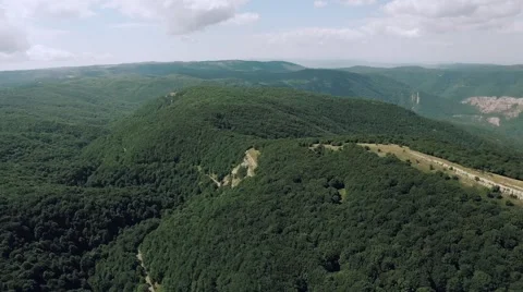 AERIAL view. Flight over forest road in mountains Stock Footage 68886354