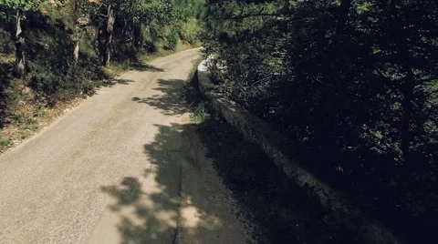 AERIAL view. Flight over forest road in mountains Stock Footage 68888039