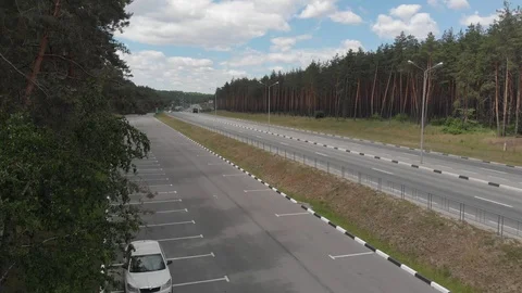 Aerial view. Flight over the forest and road Stock-Footage 90747508