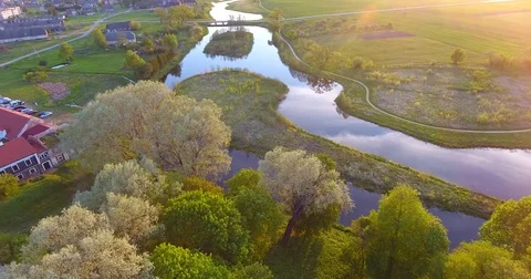 Aerial View. Flight over a green grassy fields - 007 Vídeo Stock 77570089