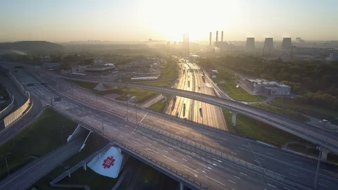 Aerial view. Flight over a huge highway in the early morning at sunrise. Stock-Footage 91542883