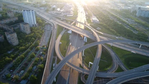 Aerial view. Flight over a huge interchange at sunrise from high altitude. Stock Footage 91543953