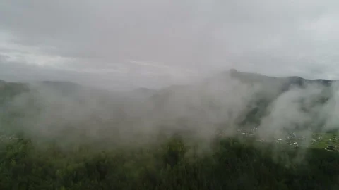 Aerial View. Flight over the Mountain Valley. Morning fog [Altai. Siberia] Stock Footage 91565481