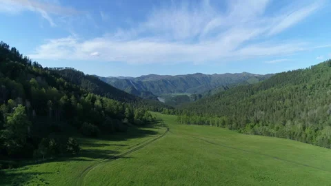 Aerial View. Flight over the Mountain Valley. Sunny summer time [Altai. Siberia] Stock Footage 91673192