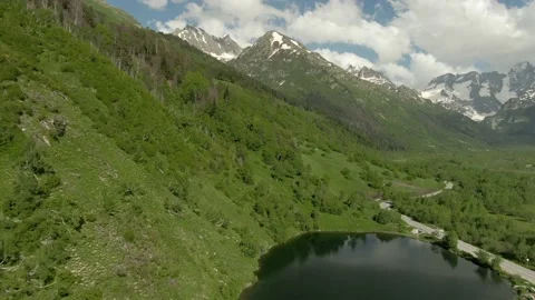 Aerial view flight over the mountain lake in the gorge. Stock Footage 156346893