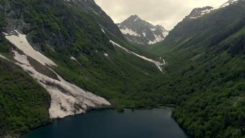 Aerial view flight over the mountain lake in the gorge. Stock Footage 156346953