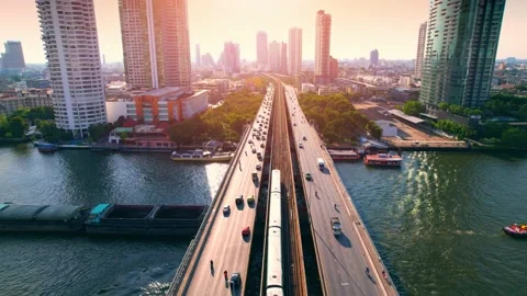 Aerial view flight over  moving sky train on a bridge over the Chao Phraya River Video stock 173738425