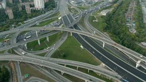 Aerial view flight over a multi-level transport interchange in Moscow at sunset. Video stock 138070998