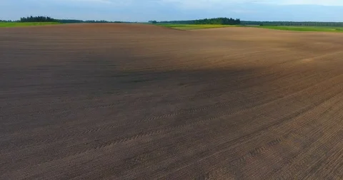 Aerial View. Flight over a plowed land. Agriculture industry. Lithuania Vídeo Stock 89831049