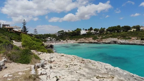 Aerial view, Flight over Porto Cristo Novo, Cala Mendia coast with villas and Stock Footage 100076053