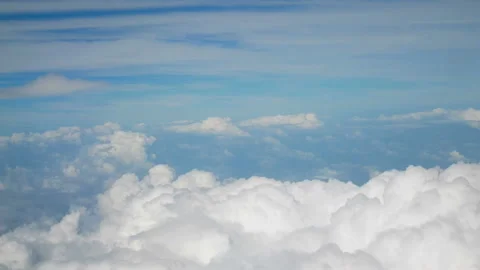 Aerial view. flight over puffy fluffy white clouds blue sky. Stock Footage 135010348