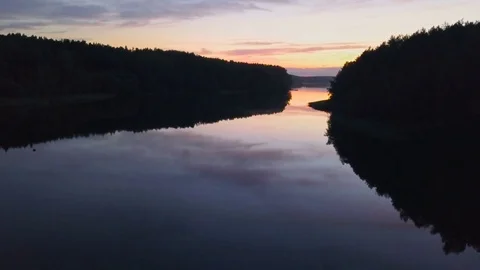 Aerial View. Flight over the river or lake after sunset. Nature background Stock Footage 80124301