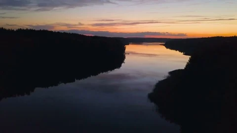 Aerial View. Flight over the river or lake after sunset. Nature background Stock Footage 81068309