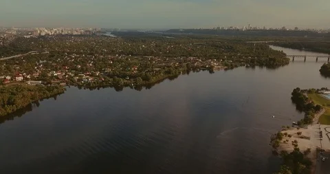 Aerial View. Flight over the river overlooking the bridge city. Sunny Day Stock Footage 89681656