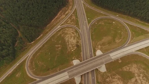 Aerial View. Flight over the road with cars near the forest. Aerial drone shot. Vídeo Stock 78559147