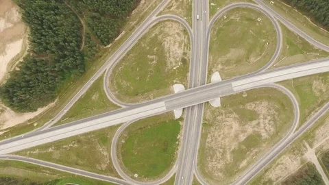 Aerial View. Flight over the road with cars near the forest. Aerial drone shot. Vídeo Stock 78559187