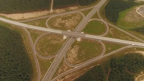 Aerial View. Flight over the road with cars near the forest. Aerial drone shot. Vídeo Stock 78561459
