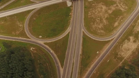 Aerial View. Flight over the road with cars near the forest. Aerial drone shot. Vídeo Stock 78561539