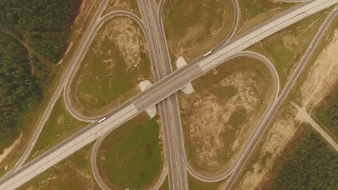 Aerial View. Flight over the road with cars near the forest. Aerial drone shot. Vídeo Stock 78563772