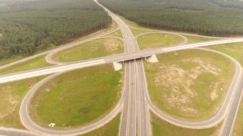 Aerial View. Flight over the road with cars near the forest. Aerial drone shot. Stock-Footage 78564171