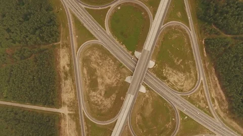Aerial View. Flight over the road with cars near the forest. Aerial drone shot. Video stock 78565890