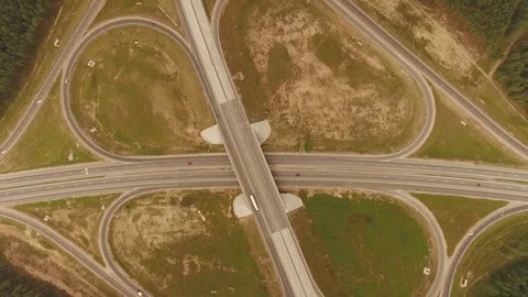 Aerial View. Flight over the road with cars near the forest. Aerial drone shot. Stock-Footage 78566820
